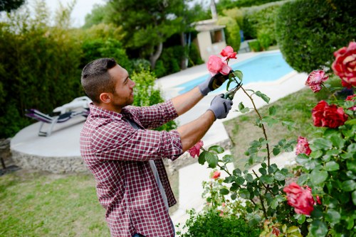 Team member preparing mower with safety checklist at a Kingston property